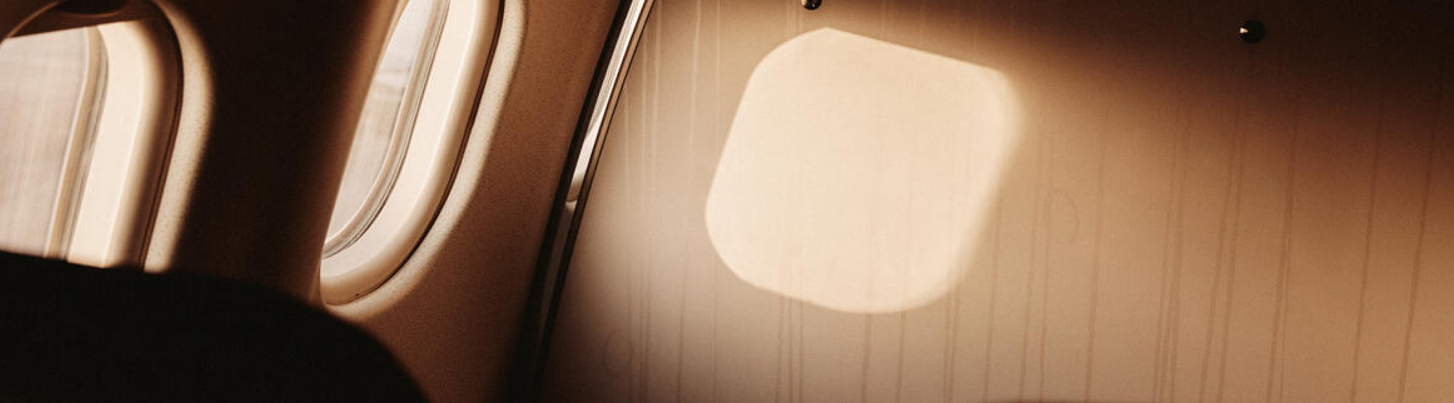 Photography of light going through an airplane window.