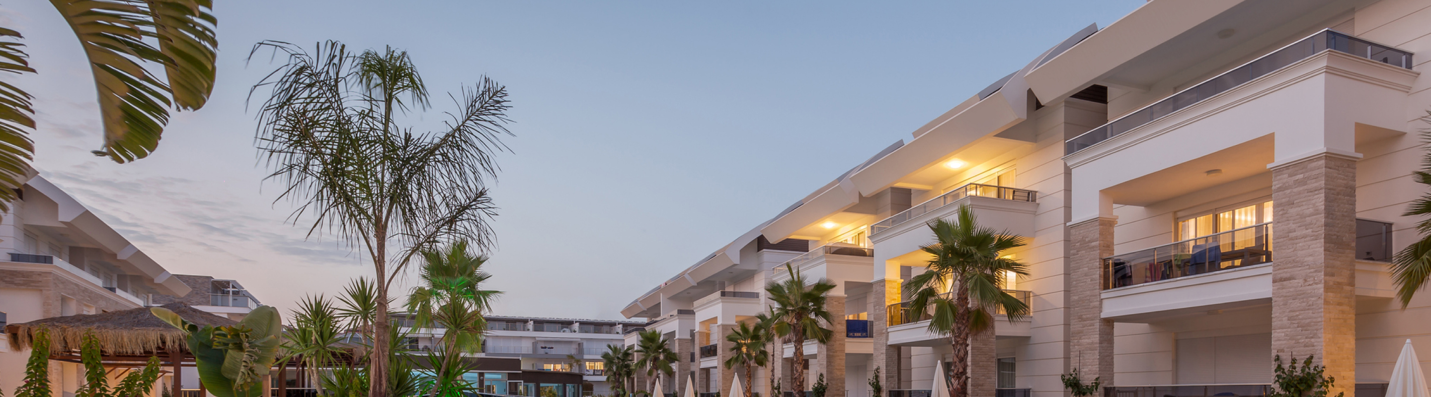 A multi-level hotel facade at dusk