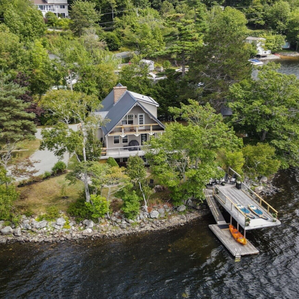 Arial Photograph of a cottage style house by the lake