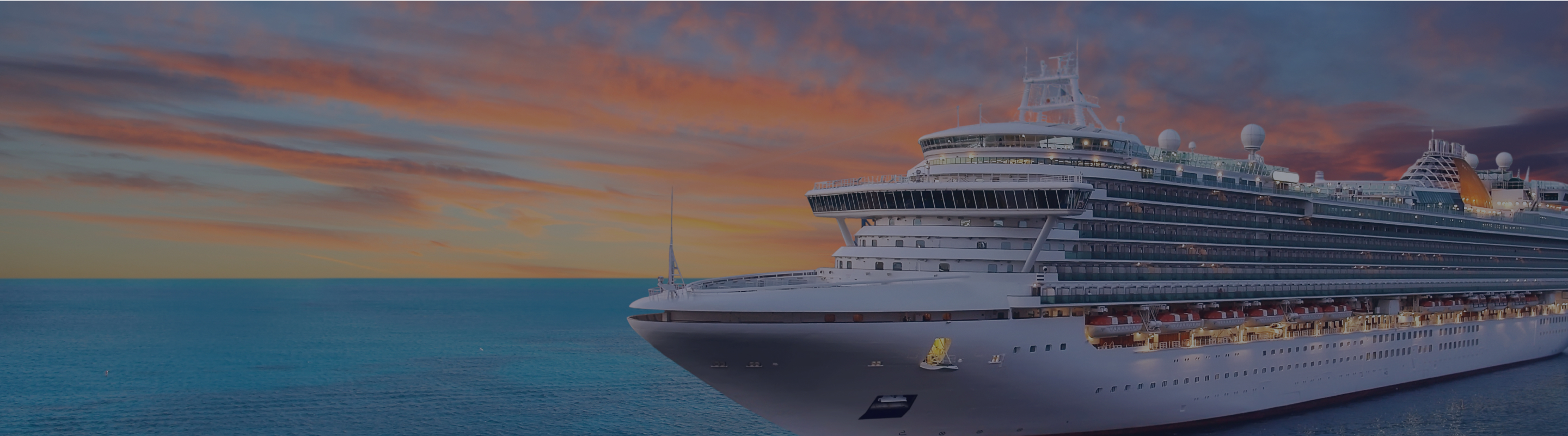 A cruise ship sailing during sunset