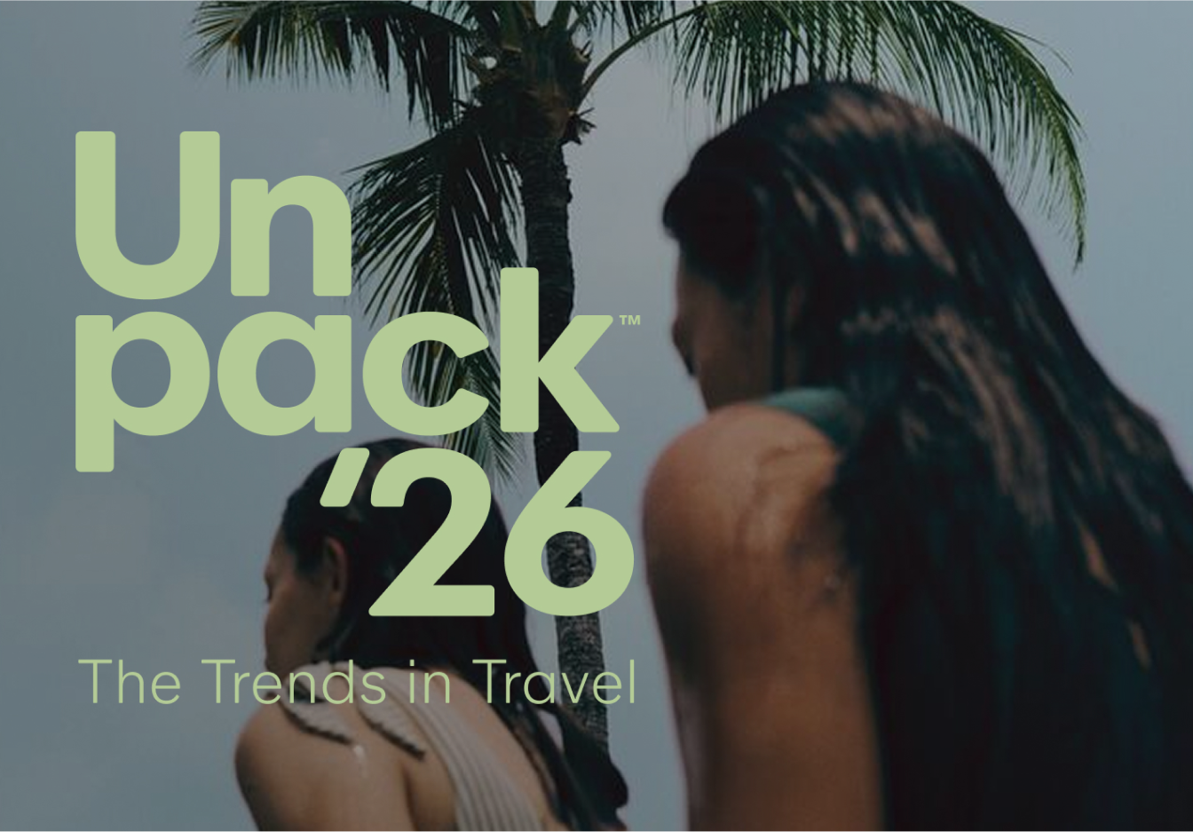 People standing under palm trees with “Unpack ‘26 The Trends in Travel” text overlay